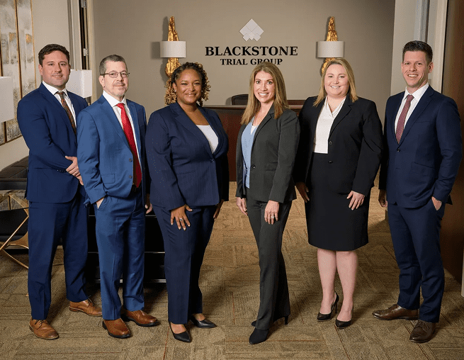 Group of professionals in formal attire.