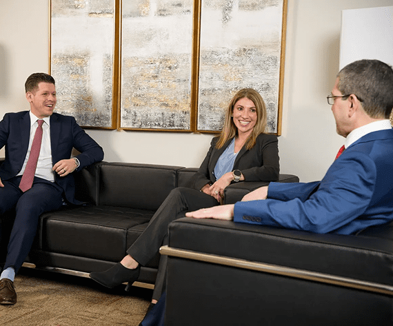 Three professionals having a business meeting.