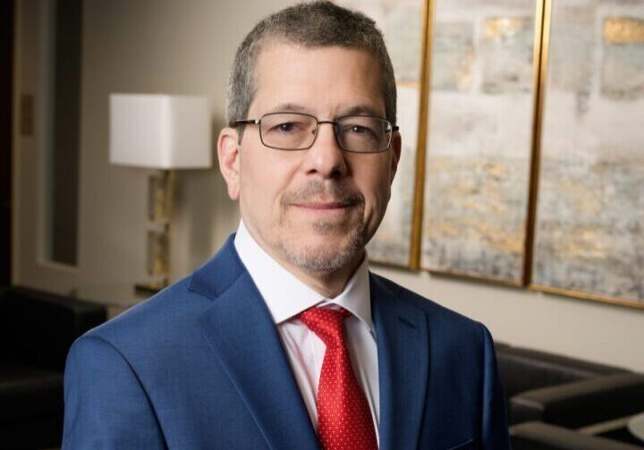 Man in blue suit and red tie